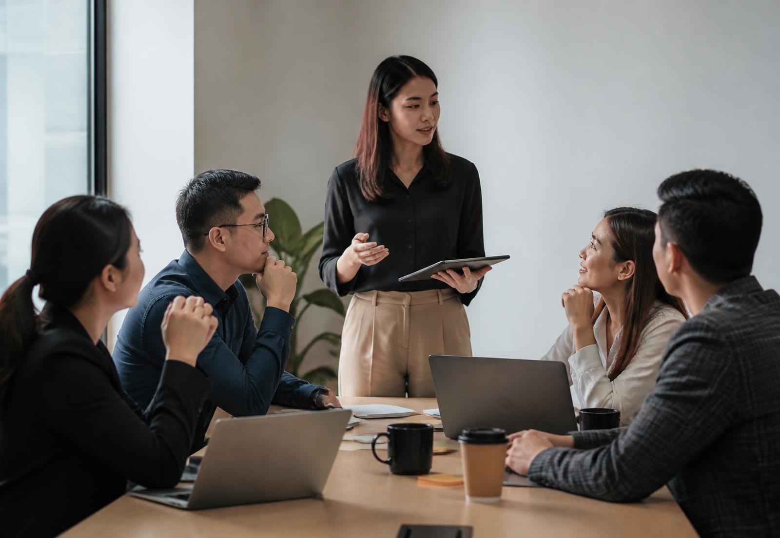 Team managers and insurance support professionals in a working session